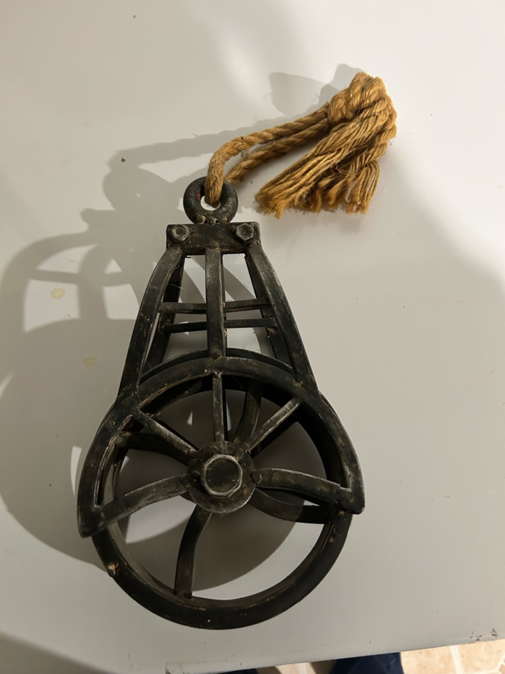 Rustic Black Metal Pulley Wall Decor with Jute Tassel